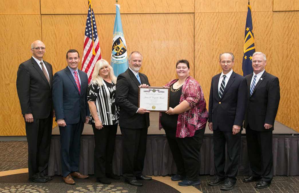 DCS Corp Group Photo being awarded James S. Cogswell Outstanding Industrial Security Achievement Award