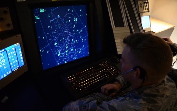 Air Traffic Control Officer looking at air traffic monitor